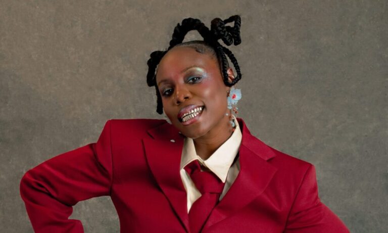 Teni Shows Us How to Make Bold Colour Work in a Crimson Suit